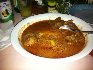 Fufu in tomato soup with goat (by sshreeves, Wikimedia Commons)