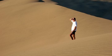 man in sand dune