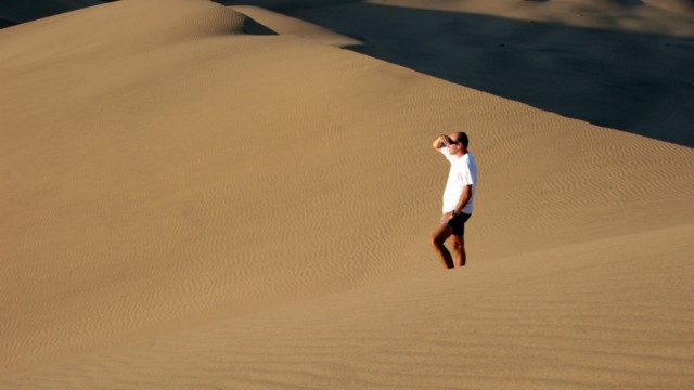man in sand dune