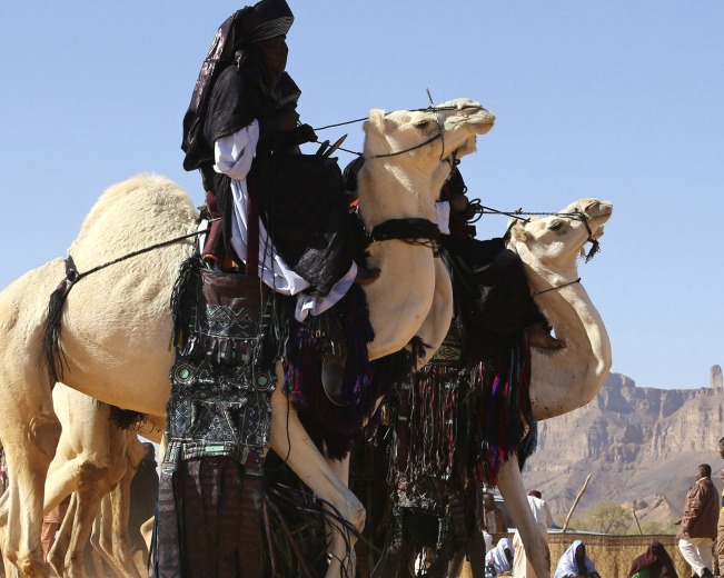 tuareg-men-ride-camels-desert-during-19th-ghat-festival-culture-tourism