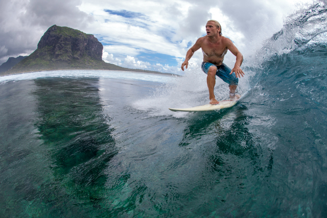 A surfer riding a wave (Shutterstock)